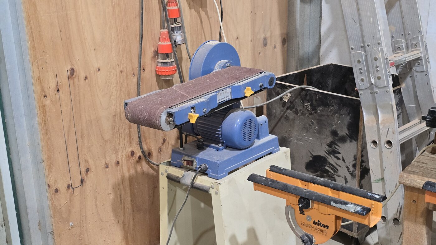 The belt sander at the shed