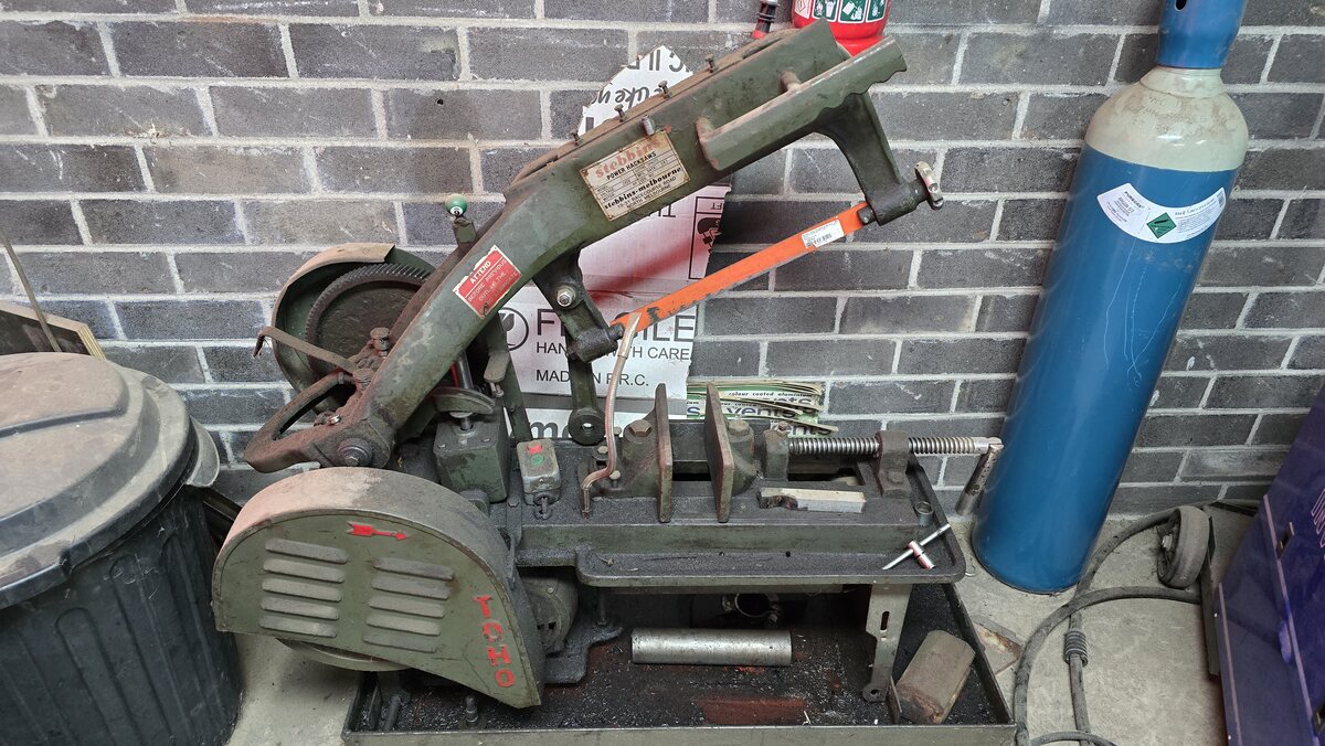 The metal cut-off bandsaw at the shed