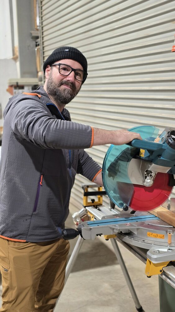 Rob Max, a member of the Bright United Men's Shed, at the mitre saw