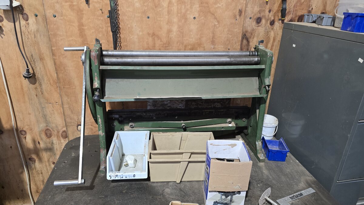 The sheet metal folder and rolls at the shed