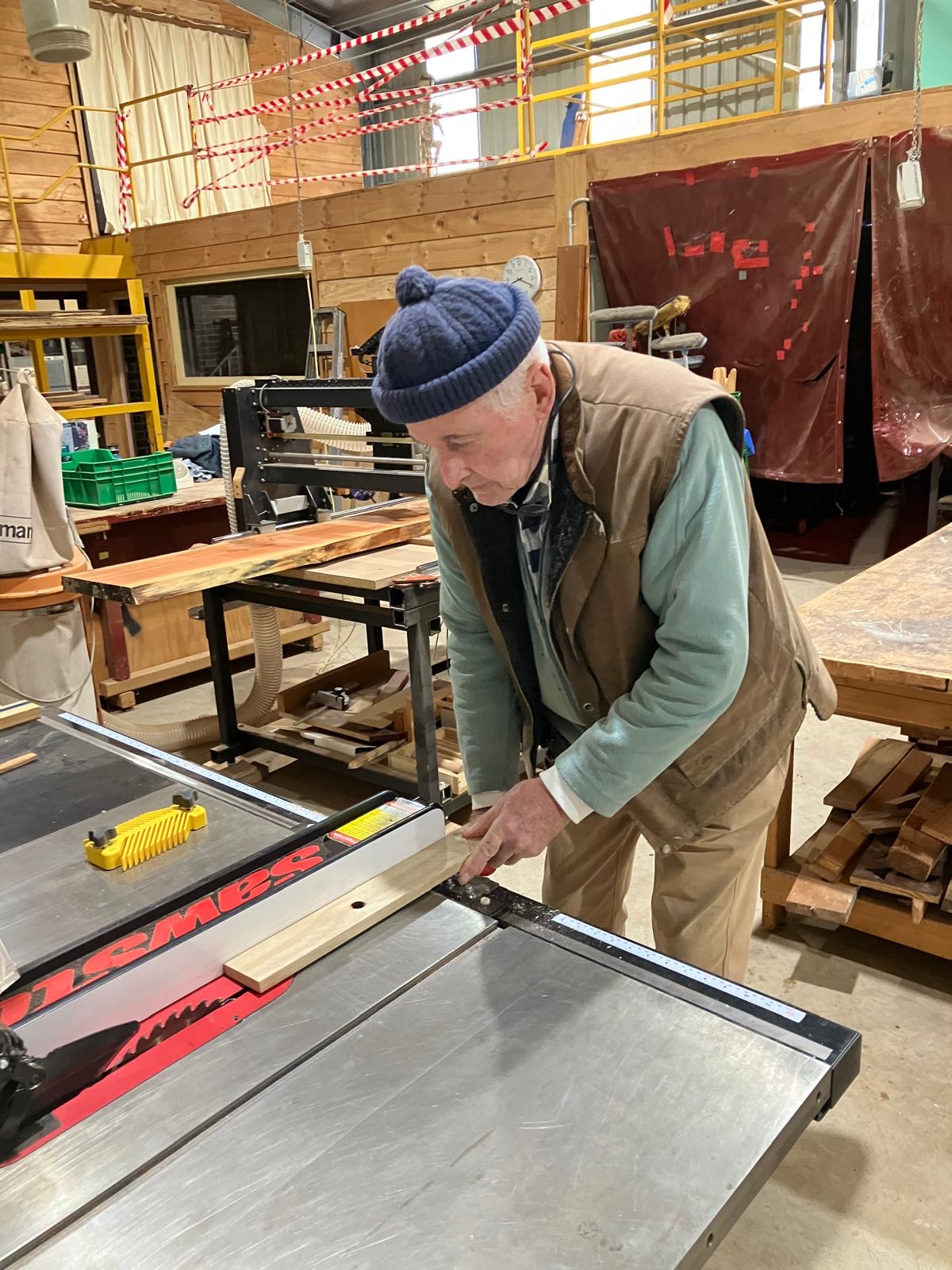 A member at the table saw